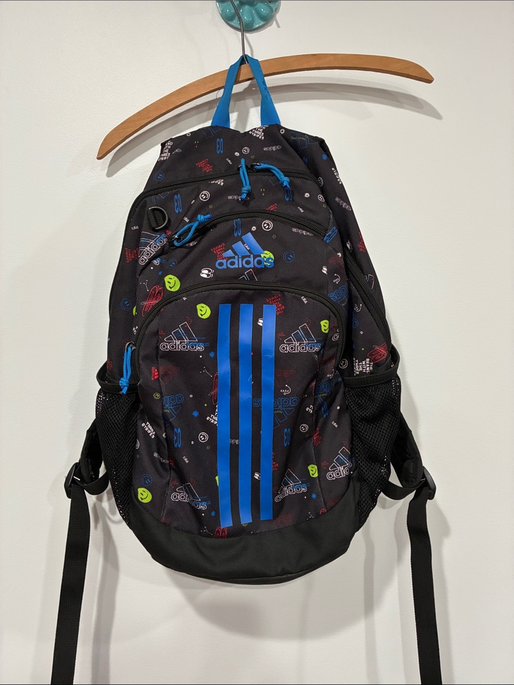 adidas Black Backpack with Bright Blue Stripes and Multicolor Accents